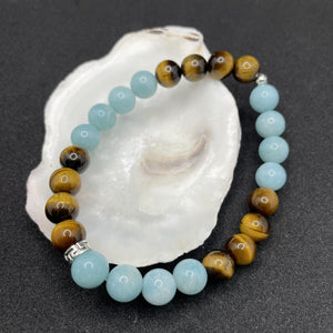bracelet en pierre haut de gamme grande qualité bleu et marron: pierres bleues amazonite et pierre marron oeil du tigre détails en argent certifié 925 pour l'anneau et la perle cache noeud.